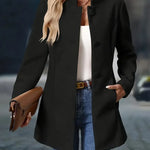Black button-front blazer jacket with notched lapel and long sleeves