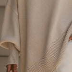 Oversized crewneck knit sweater, beige, asymmetrical draped hem with rib trim