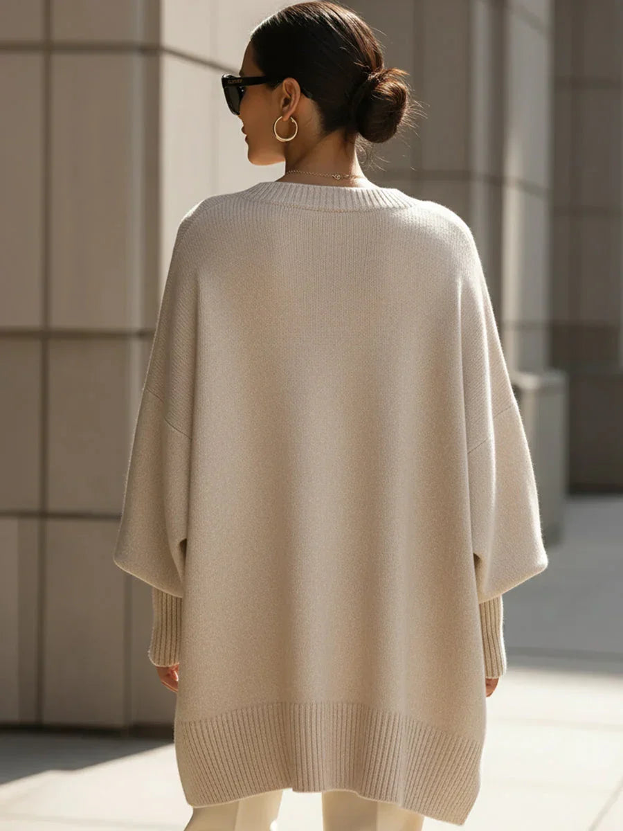 Oversized crewneck knit sweater, beige, back view with loose batwing sleeves