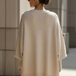 Oversized crewneck knit sweater, beige, back view with loose batwing sleeves