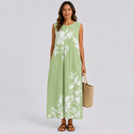 Sleeveless green floral maxi dress with gathered skirt and round neckline