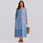 Blue and white patterned summer dress with V-neck and three-quarter sleeves