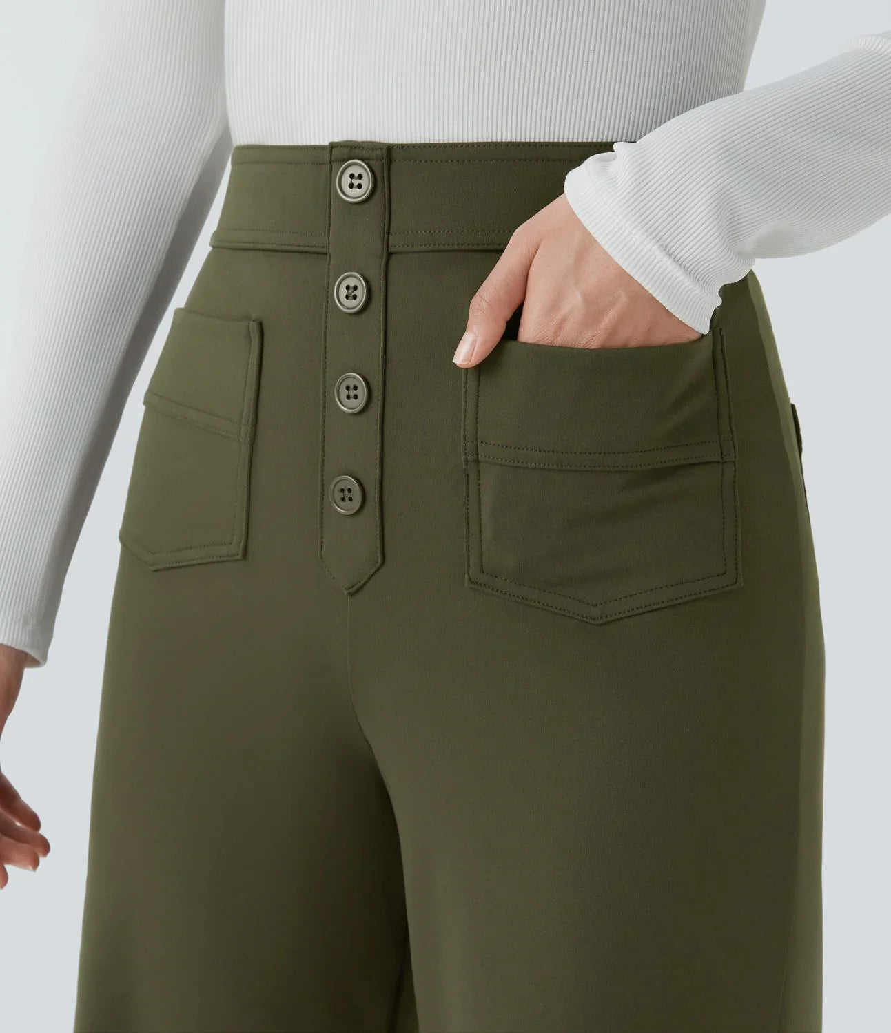 Olive-green high-rise pants with three-button placket and front patch pockets