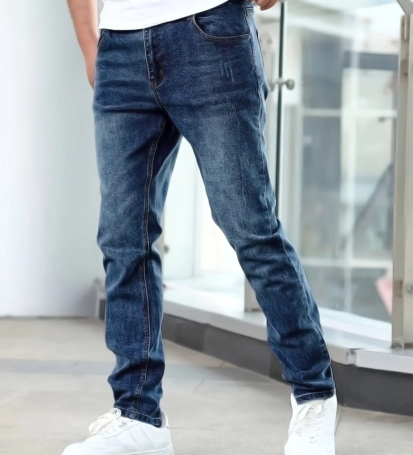 Dark blue casual stretch jeans with straight-leg fit and subtle wash pattern