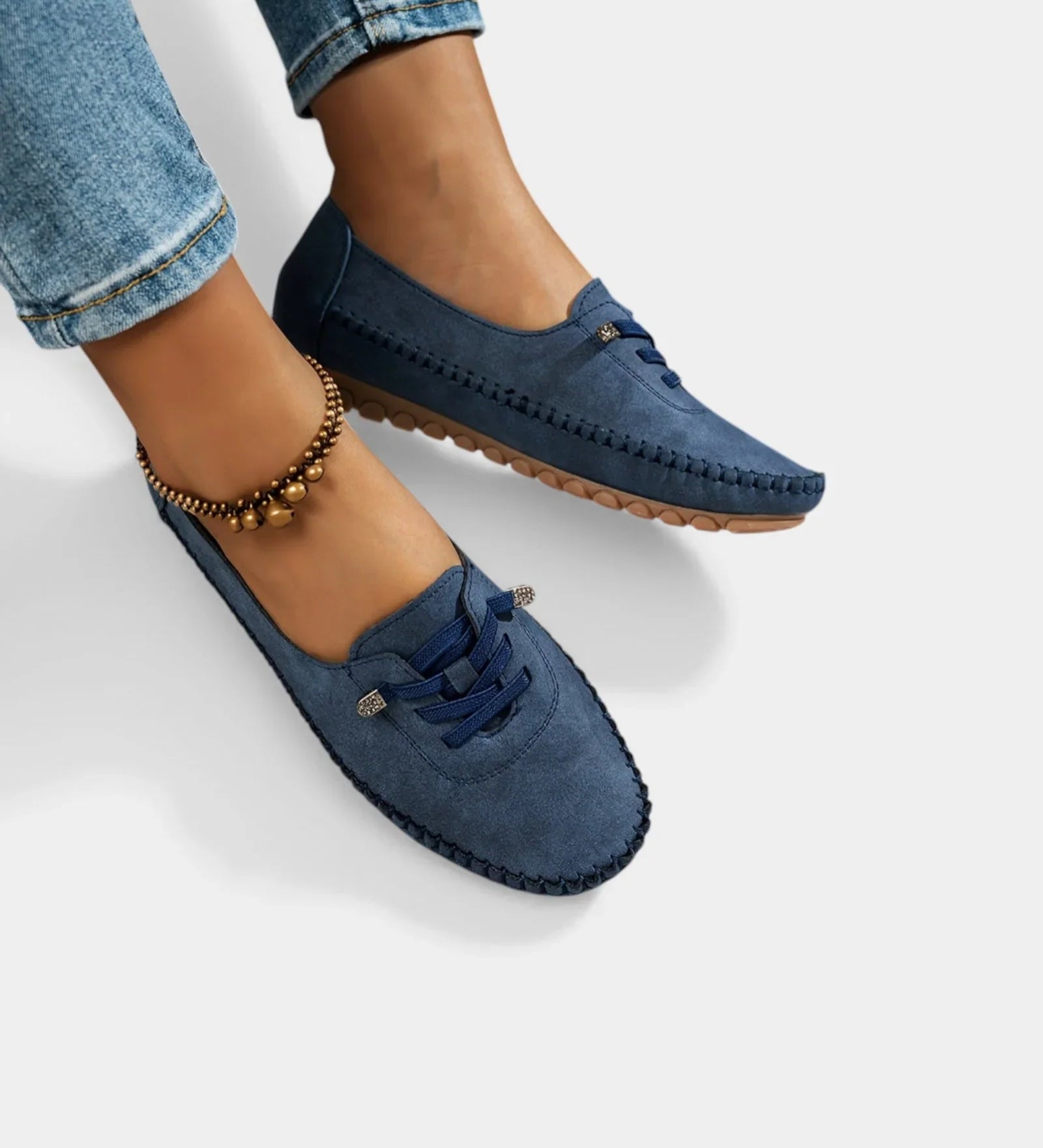 Navy suede lace-up loafers with stitched edges and low profile rubber sole.