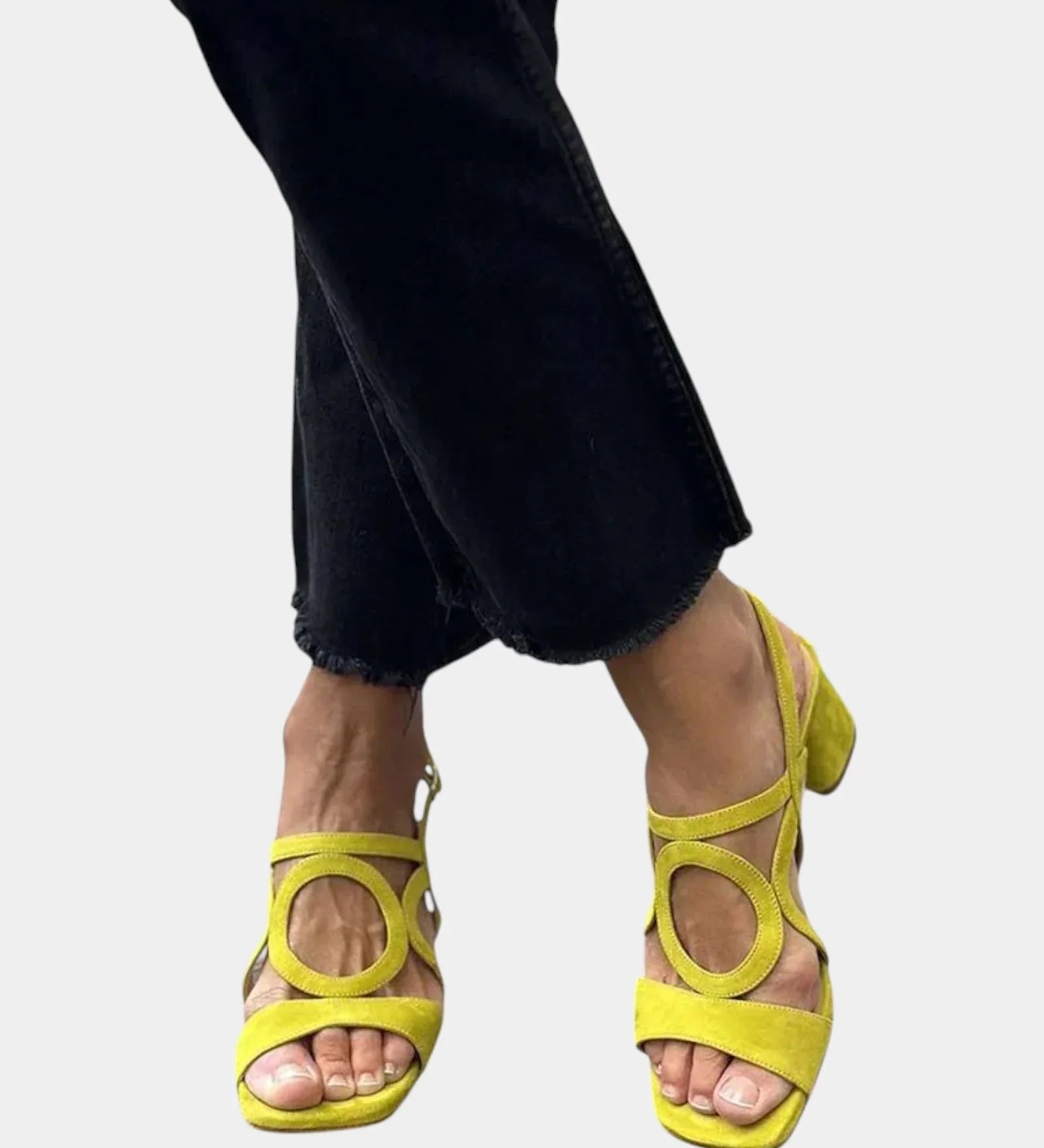 Yellow square-toe sandals with rounded cutout straps and small back heel