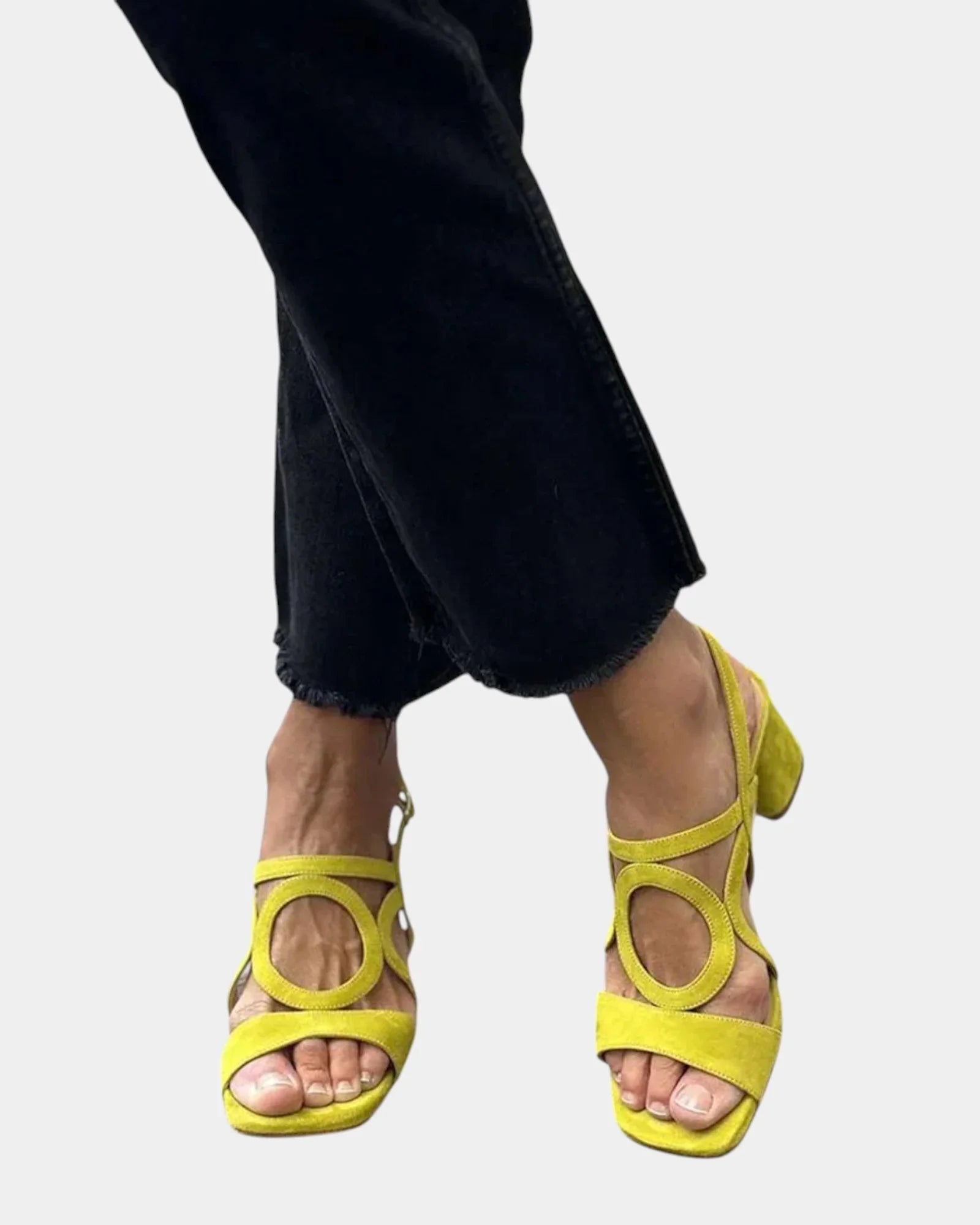 Yellow square-toe sandals with rounded cutout straps and small back heel