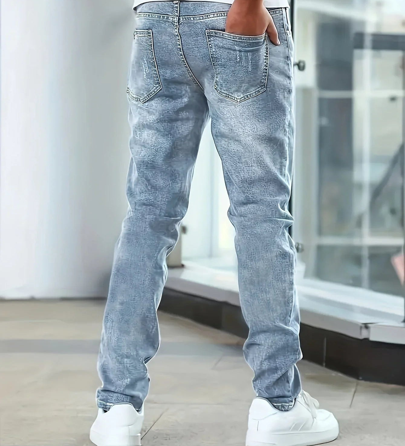 Blue casual stretch jeans, rear view with two back pockets and straight-leg cut