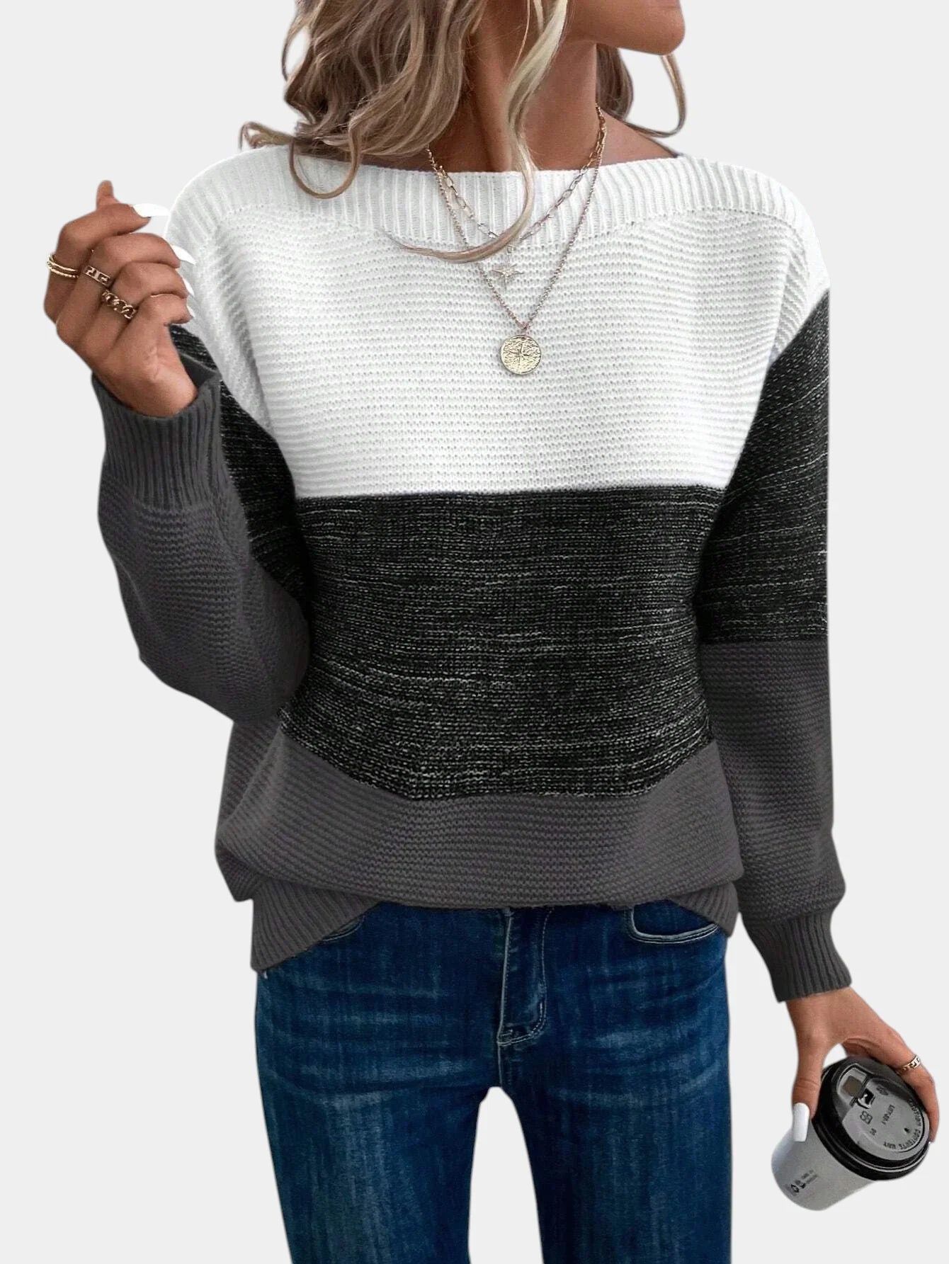 Two-tone knit pullover with crew neck, cream upper to charcoal gray gradient