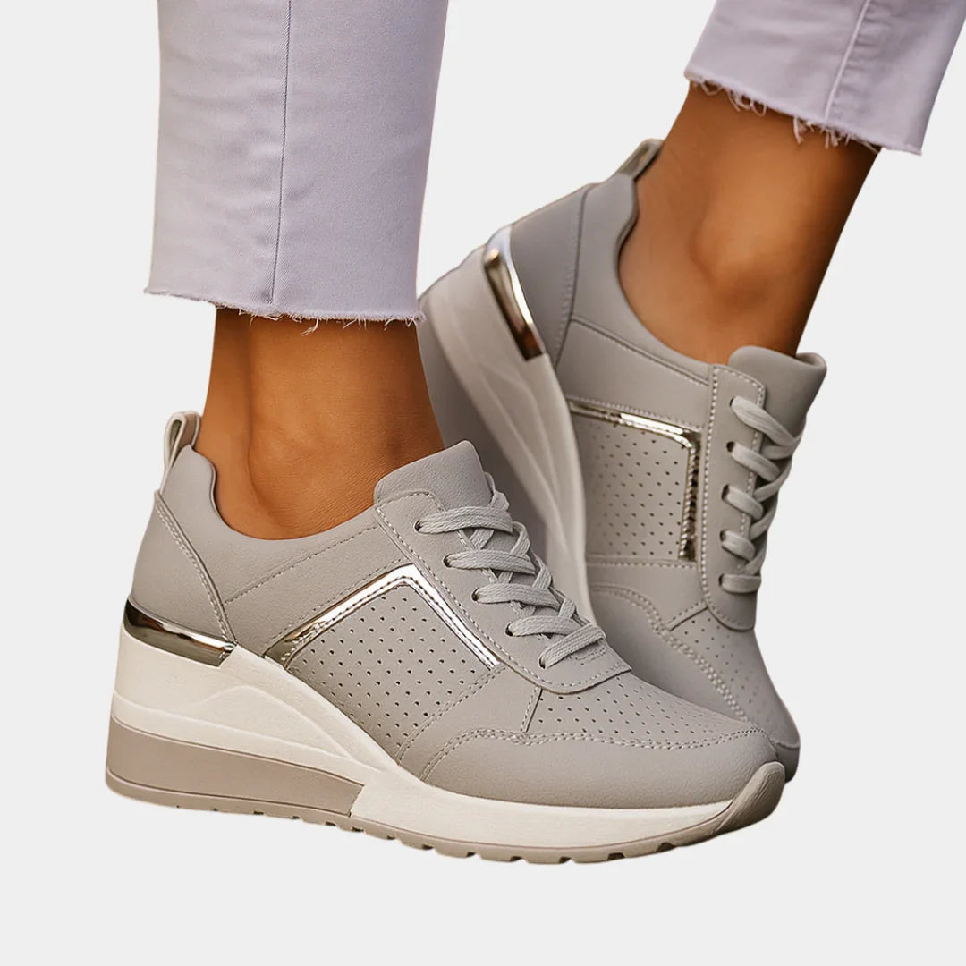 Gray orthopedic lace-up sneaker with perforated toe and metallic gold side accents