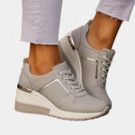Gray orthopedic lace-up sneaker with perforated toe and metallic gold side accents