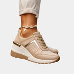 Beige orthopedic lace-up sneaker with perforated side panels and gold stripe accent