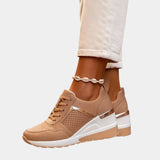 Tan orthopedic lace-up sneaker with perforated panels and gold trim on platform sole