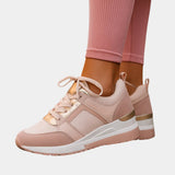 Blush pink orthopedic lace-up sneaker with gold trim and cushioned platform sole