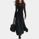 Long black tulle dress with sheer sleeves and layered flared skirt