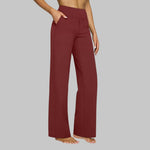 Red wide-leg pants with high-rise waist and side pockets, relaxed straight legs.