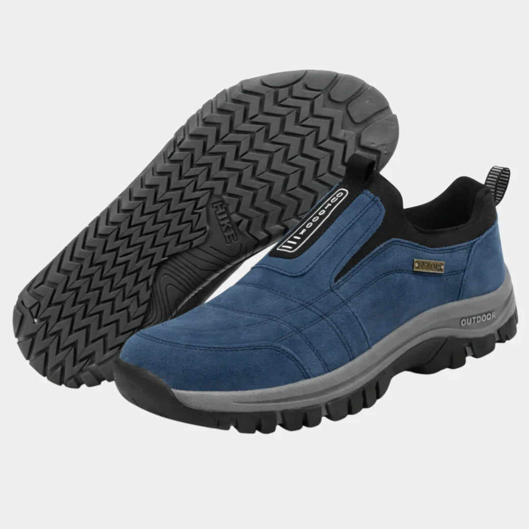 Blue slip-on orthopedic sneaker with textured non-slip outsole and padded collar