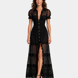 Black long dress with puff sleeves, button front, and tiered lace hem