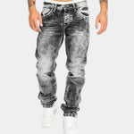 Gray stretch jeans with a tapered leg, five-pocket styling, and cuffed hem