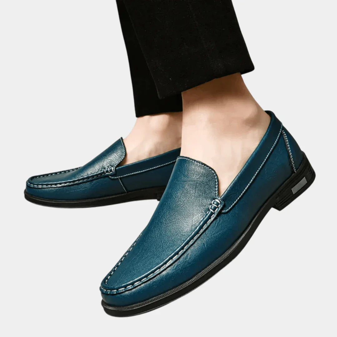 Men's blue leather loafer shoes with metal buckle and stitched moccasin trim