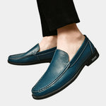 Men's blue leather loafer shoes with metal buckle and stitched moccasin trim