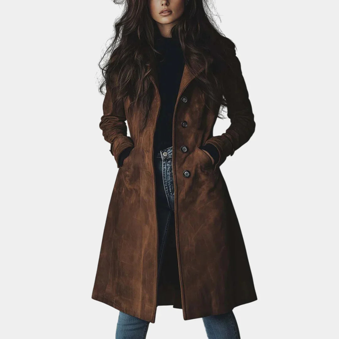 Brown suede trench coat with double-breasted buttons and long sleeves, belted waist.