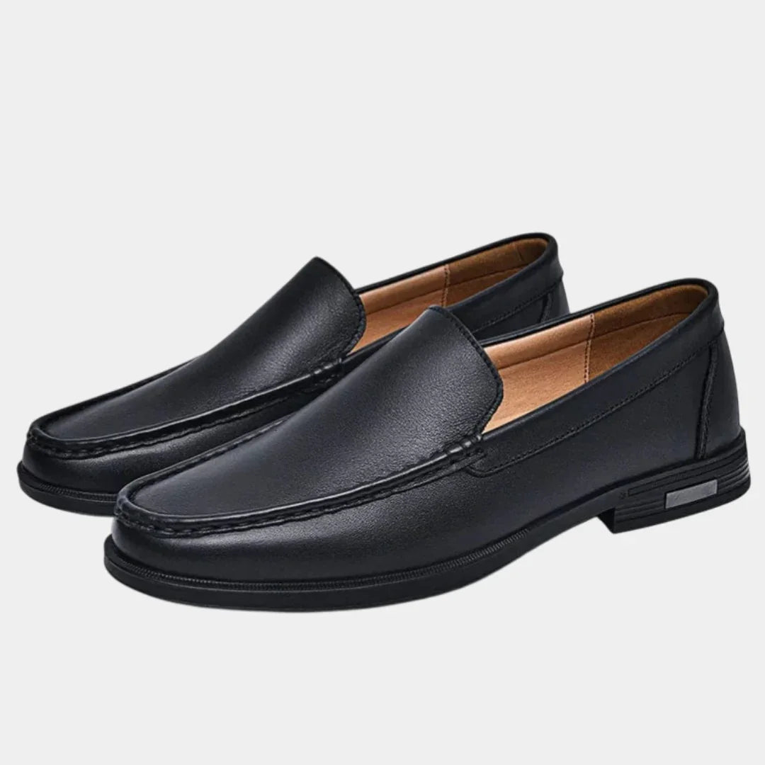 Black leather loafer slip-on with moc toe stitching and low block heel