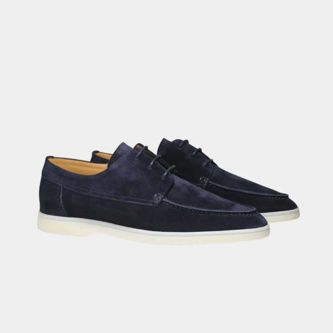 Navy blue lace-up suede loafers with low-profile white rubber sole