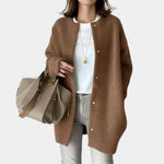 Brown button-front cardigan with long sleeves, open placket and round neckline.