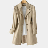 Beige spring trench coat with double-breasted buttons, notched lapels, and cuff tabs