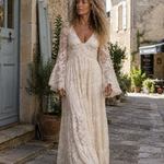 Cream lace long dress with V-neck and fitted bodice, long sleeves, flared hem