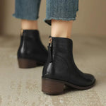 Black leather ankle boots with side zipper and low block heel