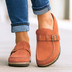 Orange orthopedic slip-on loafers with buckle strap and stitched moc toe