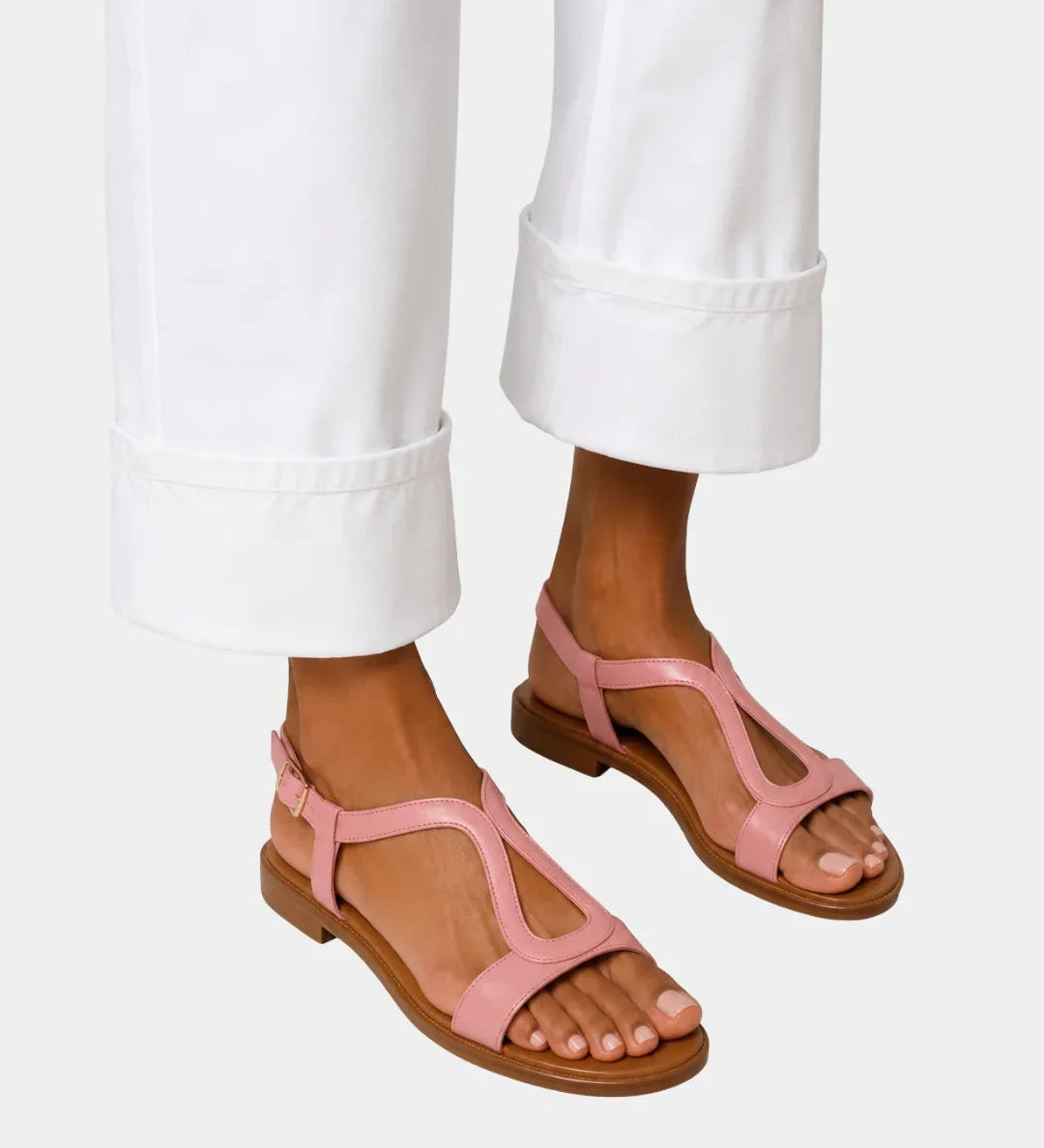Pink T-strap open-toe sandals with low block heel and ankle strap
