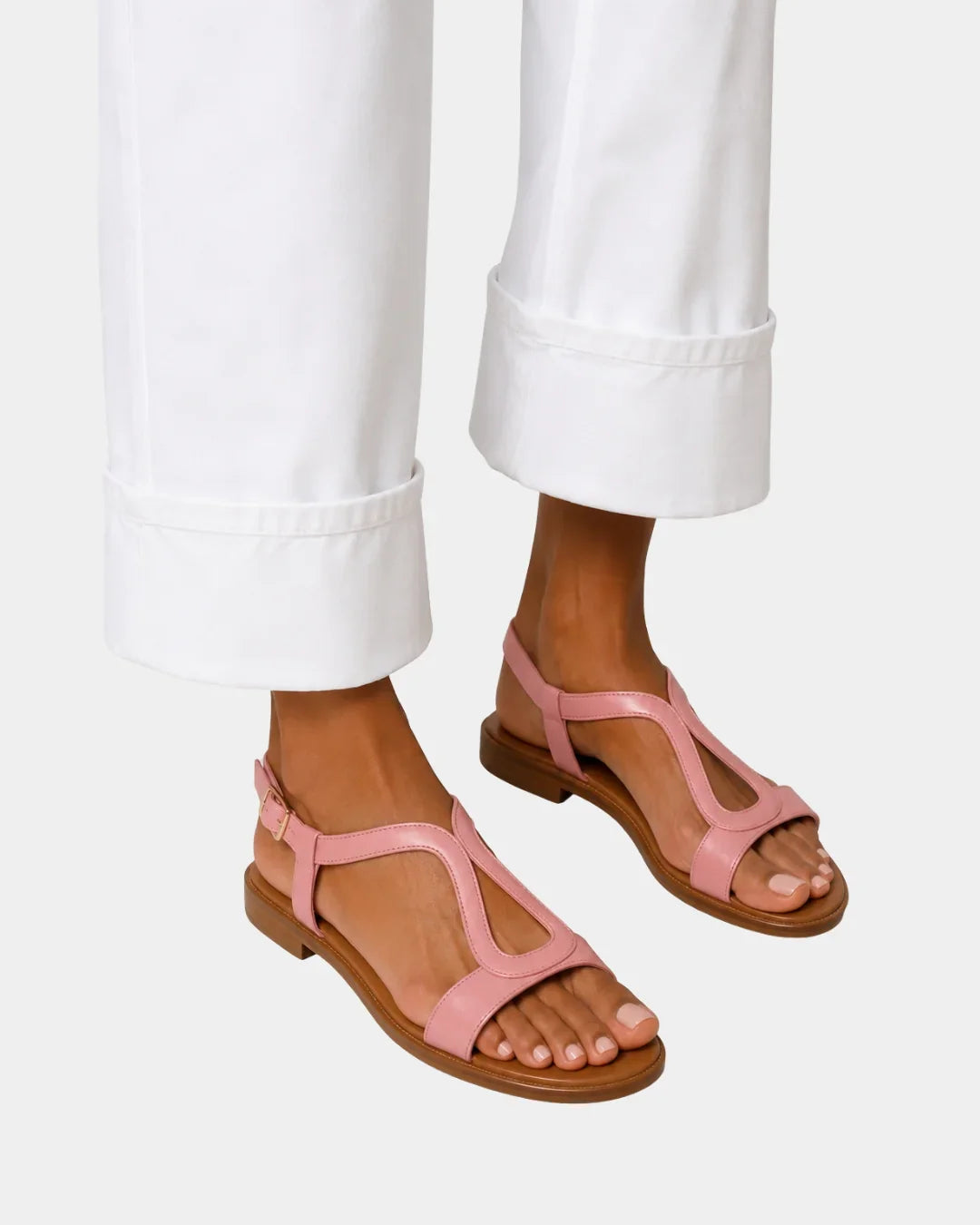 Pink T-strap open-toe sandals with low block heel and ankle strap
