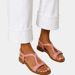 Pink T-strap open-toe sandals with low block heel and ankle strap