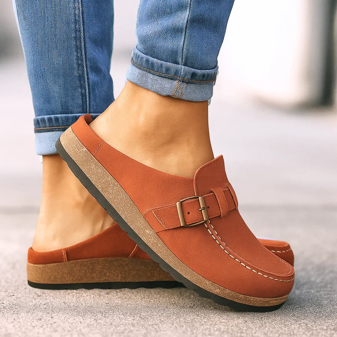 Rust orange orthopedic slip-on loafers with buckle strap and cushioned sole