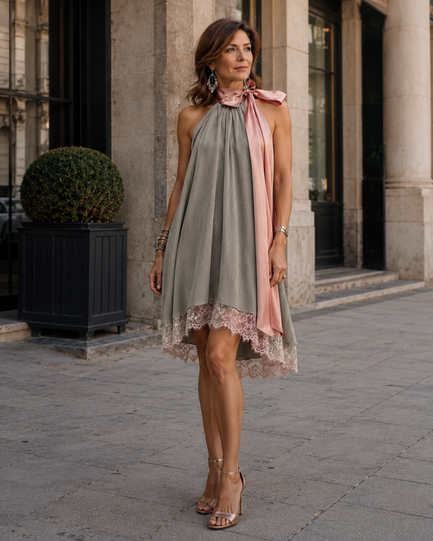 Gray sleeveless halter dress, lace trim hem, pink sash-style neck tie