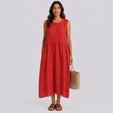 Red sleeveless summer dress with embroidered floral eyelet detail and tiered skirt