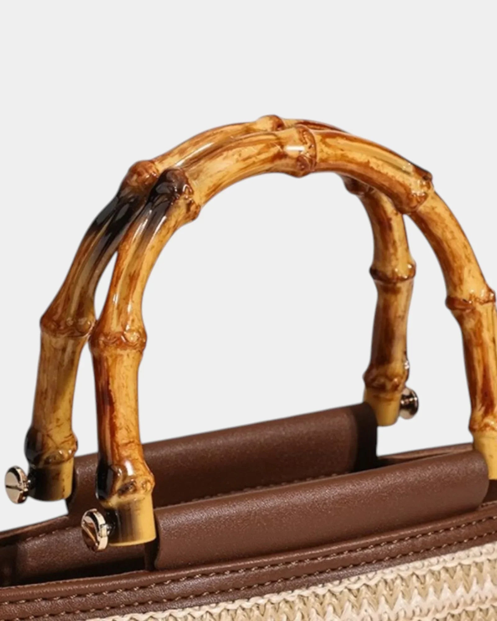 Knitted style bag with bamboo top handle and brown faux-leather front
