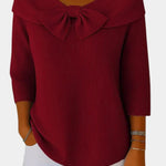 Deep red ribbed knit top with bow-knot neckline and 3/4 sleeves