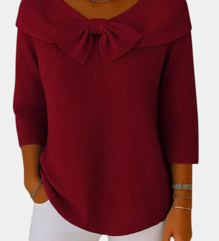 Deep red ribbed knit top with bow-knot neckline and 3/4 sleeves