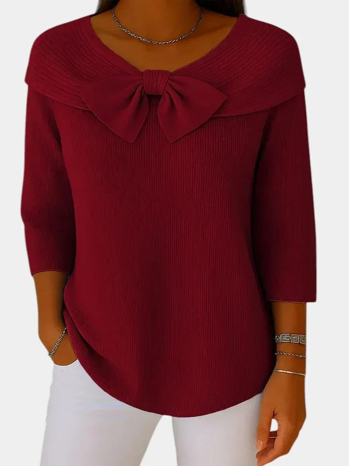 Deep red ribbed knit top with bow-knot neckline and 3/4 sleeves
