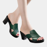 Green orthopedic slide sandals with wide cross straps and chunky block heel