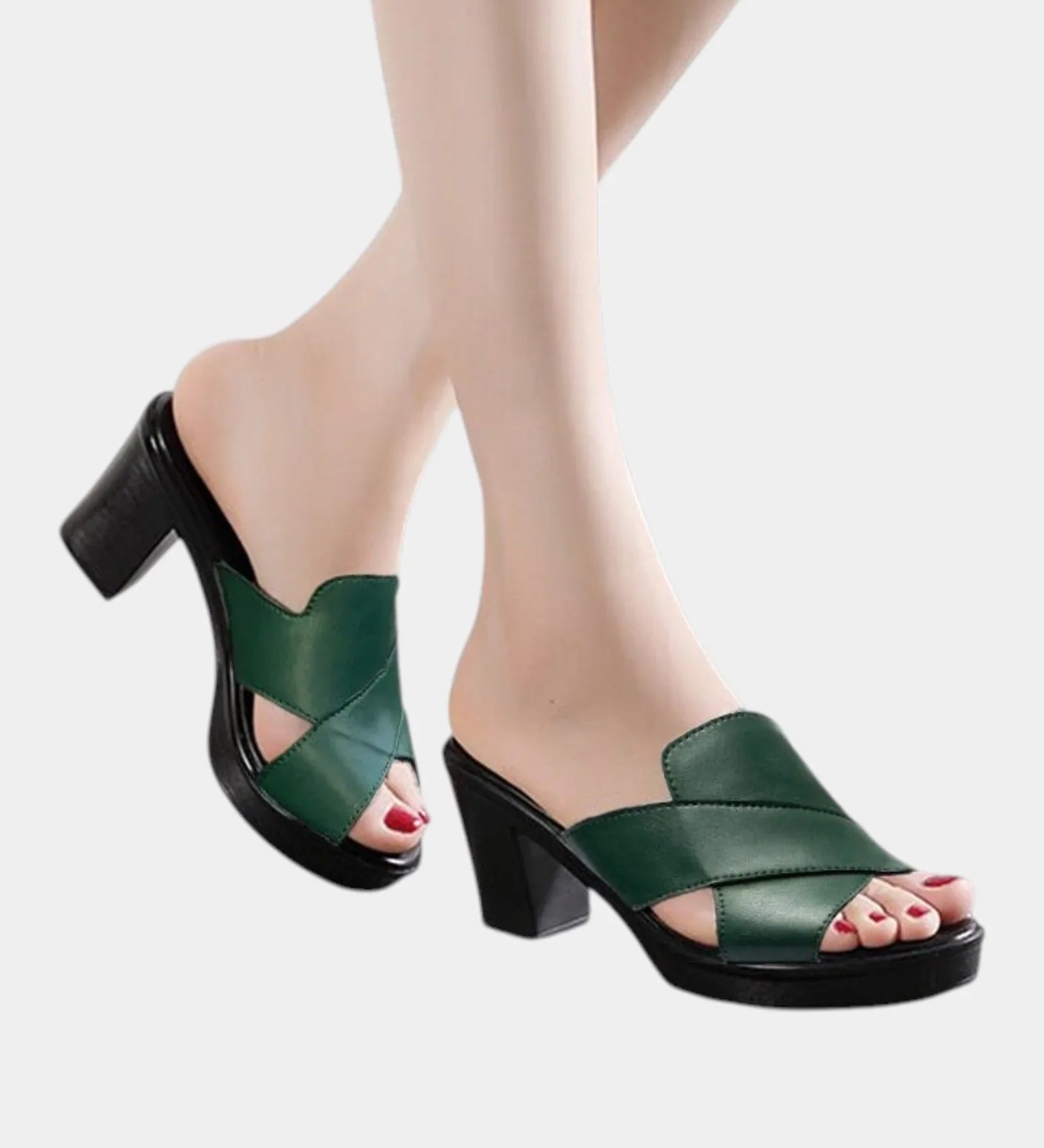 Green orthopedic slide sandals with wide cross straps and chunky block heel