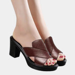 Orthopedic slide sandal with open toe, two straps, brown leather and black block heel
