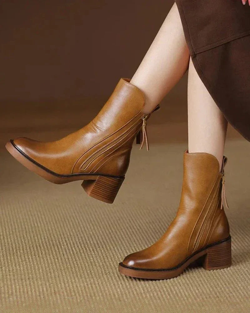 Brown leather ankle boots with side zips and tassel pull tabs