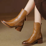 Brown leather ankle boots with side zips and tassel pull tabs