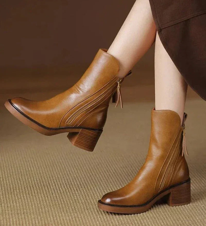 Brown leather ankle boots with side zips and tassel pull tabs