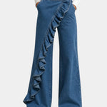 Blue ruffle-front wide-leg denim pants with gold button and scalloped trim